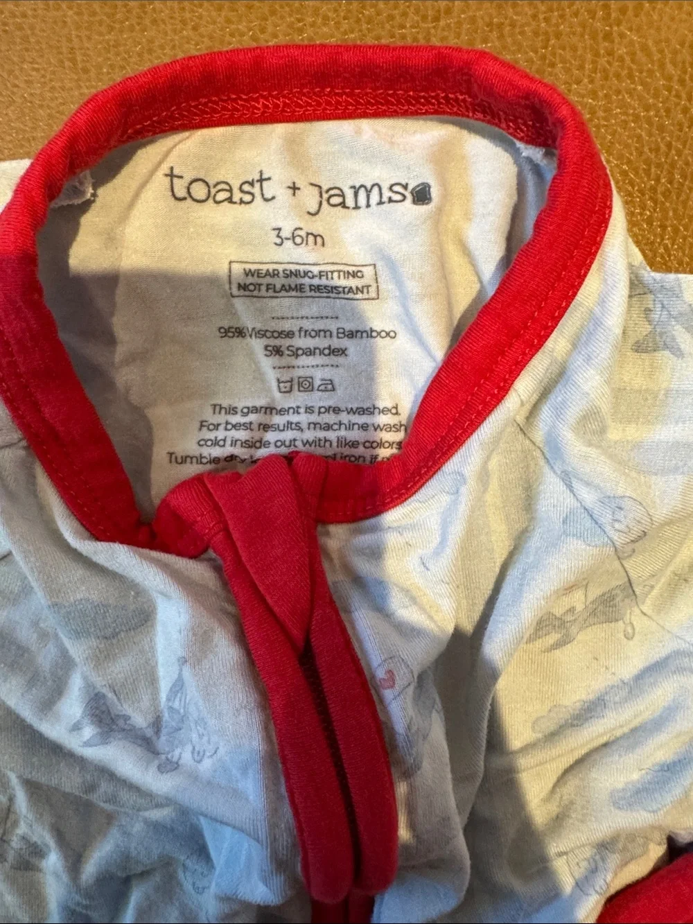 Toast + Jams Cream Airplane Footie with Red bamboo stretch pajamas 2 way zip